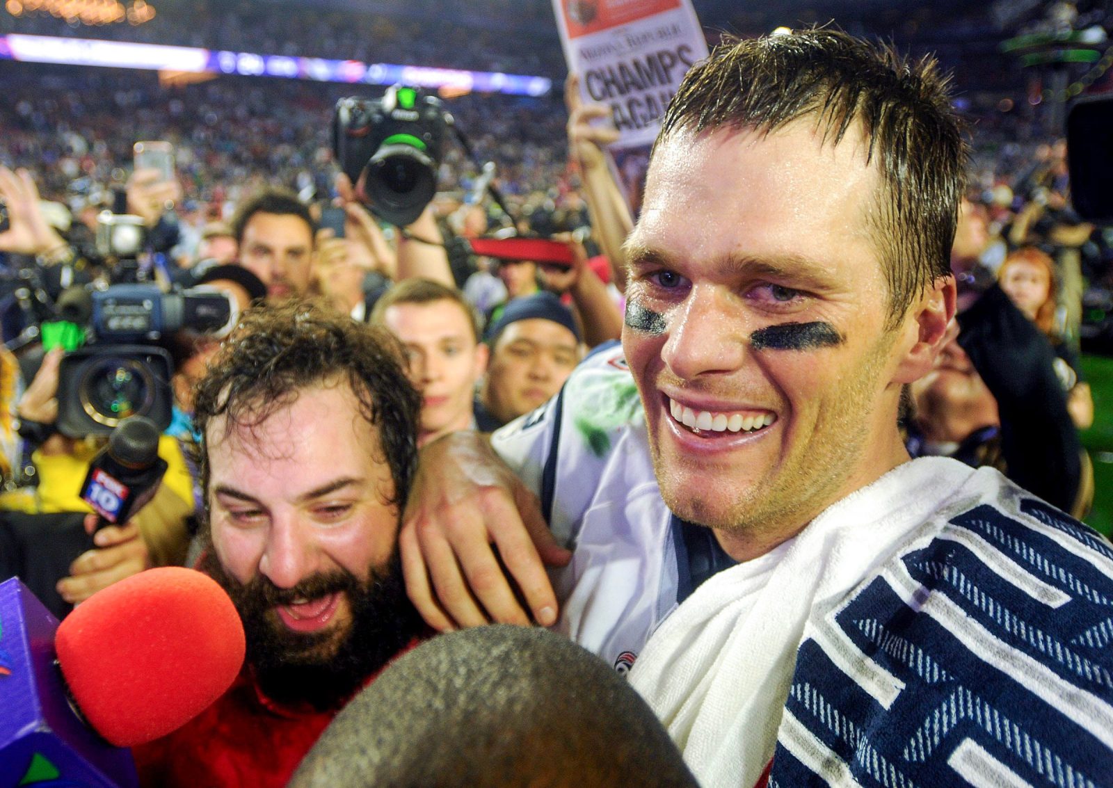 Patriots quarterback Tom Brady celebrates with Defensive Coordinator Matt Patricia after Super Bowl XLIX at the University of Phoenix Stadium, Feb. 1, 2015.