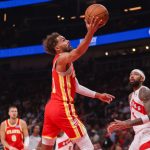 Oct 22, 2025; Atlanta, Georgia, USA; Atlanta Hawks guard Trae Young (11) shoots against the Toronto Raptors in the first quarter at State Farm Arena.