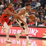 Oct 24, 2025; Toronto, Ontario, CAN; Milwaukee Bucks forward Giannis Antetokounmpo (34) dribbles past Toronto Raptors guard Ochai Agbaji (30) in the second quarter at Scotiabank Arena. Mandatory Credit: Gerry Angus-Imagn Images