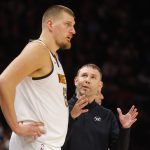 Oct 27, 2025; Minneapolis, Minnesota, USA; Denver Nuggets head coach David Adelman directs center Nikola Jokic (15) against the Minnesota Timberwolves in the fourth quarter at Target Center. Mandatory Credit: Bruce Kluckhohn-Imagn Images