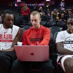 Nov 3, 2025; Portland, Oregon, USA; Portland Trail Blazers assistant coach Patrick St. Andrews instructs forward Jerami Grant (9), left, and guard Jrue Holiday (5) before a game against the Los Angeles Lakers at Moda Center.