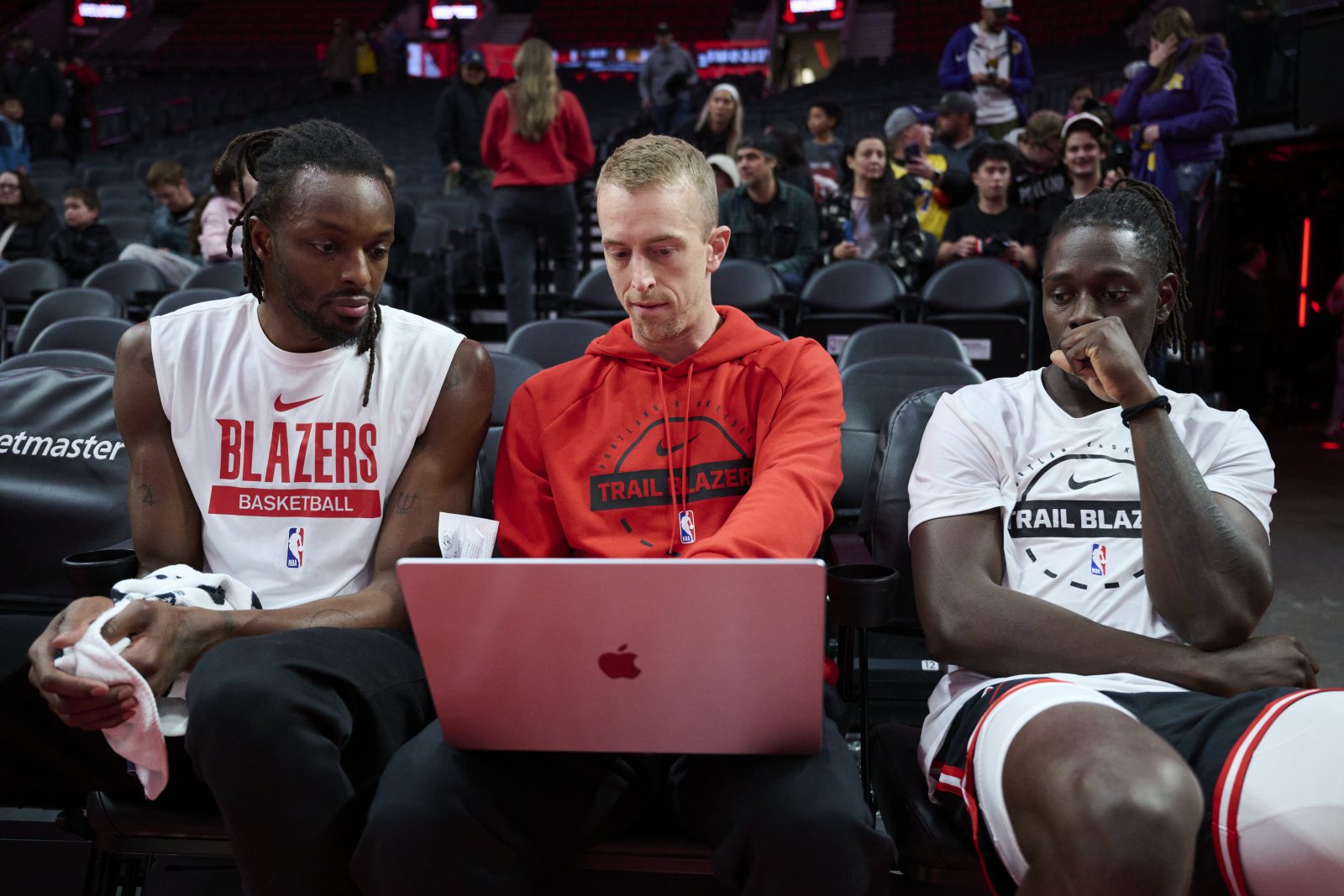 Nov 3, 2025; Portland, Oregon, USA; Portland Trail Blazers assistant coach Patrick St. Andrews instructs forward Jerami Grant (9), left, and guard Jrue Holiday (5) before a game against the Los Angeles Lakers at Moda Center.