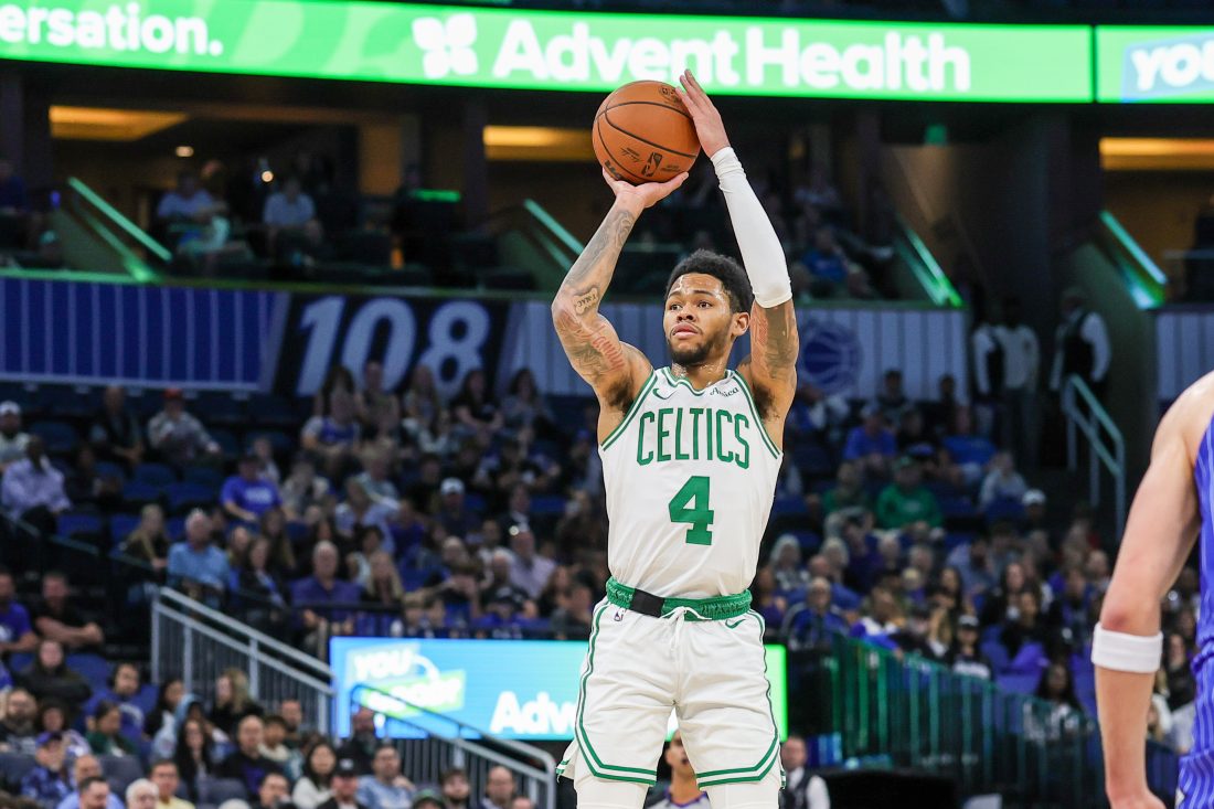 Nov 9, 2025; Orlando, Florida, USA; Boston Celtics guard Anfernee Simons (4) shoots a three point basket during the second quarter against the Orlando Magic at Kia Center. Mandatory Credit: Mike Watters-Imagn Images
