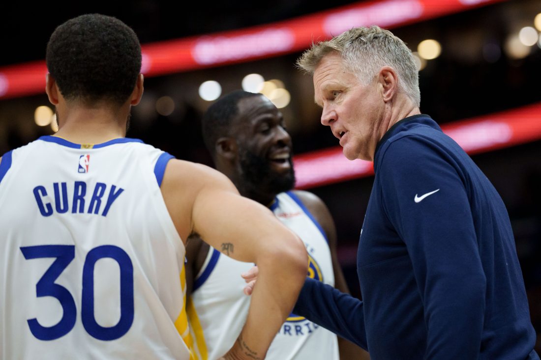 Nov 16, 2025; New Orleans, Louisiana, USA; Golden State Warriors head coach Steve Kerr talks to guard Stephen Curry (30) and forward Draymond Green (23) during the first half against the New Orleans Pelicans at Smoothie King Center.