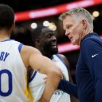 Nov 16, 2025; New Orleans, Louisiana, USA; Golden State Warriors head coach Steve Kerr talks to guard Stephen Curry (30) and forward Draymond Green (23) during the first half against the New Orleans Pelicans at Smoothie King Center.