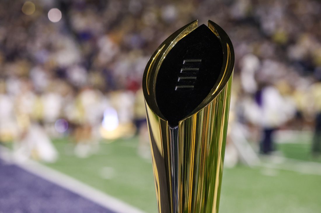 Nov 22, 2025; Atlanta, Georgia, USA; A view of the college football playoff national championship trophy on the sidelines of a game between the Georgia Tech Yellow Jackets and Pittsburgh Panthers in the first quarter at Bobby Dodd Stadium at Hyundai Field.