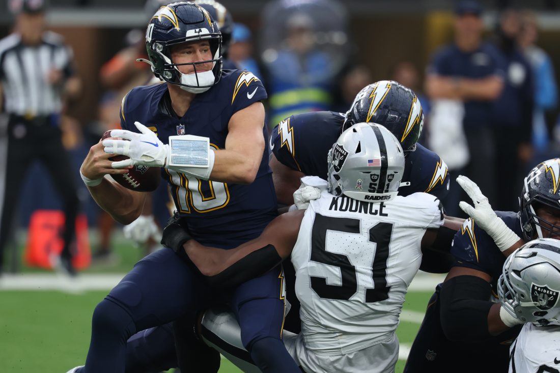 Nov 30, 2025; Inglewood, California, USA; Las Vegas Raiders defensive end Malcolm Koonce (51) sacks Los Angeles Chargers quarterback Justin Herbert (10) during the second half at SoFi Stadium. Mandatory Credit: Kiyoshi Mio-Imagn Images