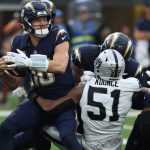 Nov 30, 2025; Inglewood, California, USA; Las Vegas Raiders defensive end Malcolm Koonce (51) sacks Los Angeles Chargers quarterback Justin Herbert (10) during the second half at SoFi Stadium. Mandatory Credit: Kiyoshi Mio-Imagn Images
