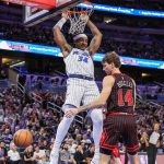 Dec 1, 2025; Orlando, Florida, USA; Orlando Magic center Wendell Carter Jr. (34) dunks in front of Chicago Bulls forward Matas Buzelis (14) during the first quarter at Kia Center. Mandatory Credit: Mike Watters-Imagn Images
