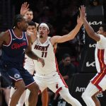 Dec 1, 2025; Miami, Florida, USA; Miami Heat forward Jaime Jaquez Jr. (11) defends Los Angeles Clippers forward Kawhi Leonard (2) during the second half at Kaseya Center.