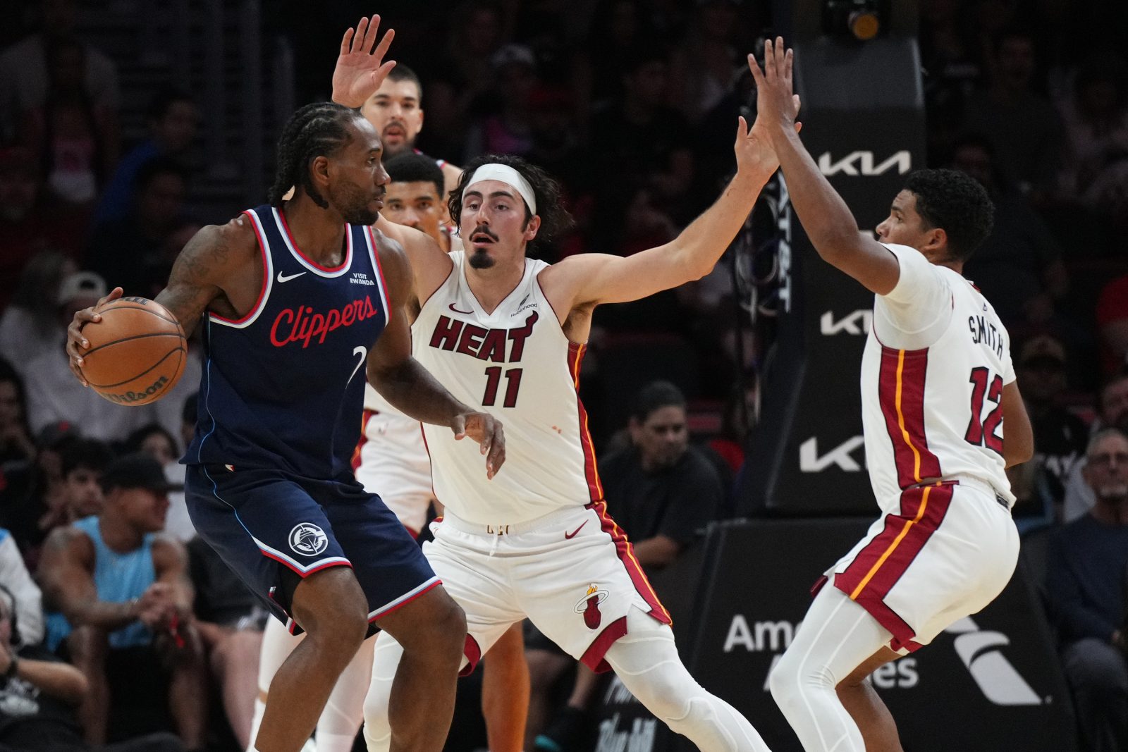 Dec 1, 2025; Miami, Florida, USA; Miami Heat forward Jaime Jaquez Jr. (11) defends Los Angeles Clippers forward Kawhi Leonard (2) during the second half at Kaseya Center.