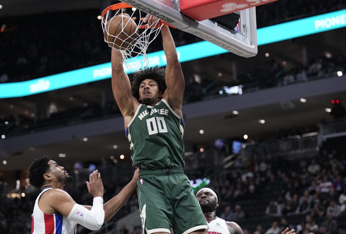 Dec 3, 2025; Milwaukee, Wisconsin, USA; Milwaukee Bucks center Jericho Sims (00) dunks the ball in the first half against the Detroit Pistons at Fiserv Forum.