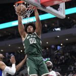 Dec 3, 2025; Milwaukee, Wisconsin, USA; Milwaukee Bucks center Jericho Sims (00) dunks the ball in the first half against the Detroit Pistons at Fiserv Forum.