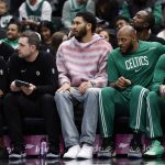 Dec 4, 2025; Washington, District of Columbia, USA; Injured Boston Celtics forward Jayson Tatum (M) looks on from the bench against the Washington Wizards in the first half at Capital One Arena. Mandatory Credit: Geoff Burke-Imagn Images
