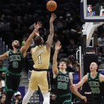 Dec 4, 2025; Washington, District of Columbia, USA; Washington Wizards forward Cam Whitmore (1) shoots the ball as Boston Celtics guard Derrick White (9) defends in the first half at Capital One Arena.