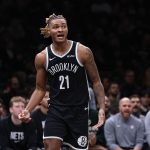 Dec 6, 2025; Brooklyn, New York, USA; Brooklyn Nets forward Noah Clowney (21) reacts after a play during the second half against the New Orleans Pelicans at Barclays Center. Mandatory Credit: Vincent Carchietta-Imagn Images