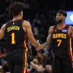 Dec 6, 2025; Washington, District of Columbia, USA; Atlanta Hawks forward Jalen Johnson (1) celebrates with Hawks guard Nickeil Alexander-Walker (7) after scoring while being fouled against the Washington Wizards in the second half at Capital One Arena. Mandatory Credit: Geoff Burke-Imagn Images