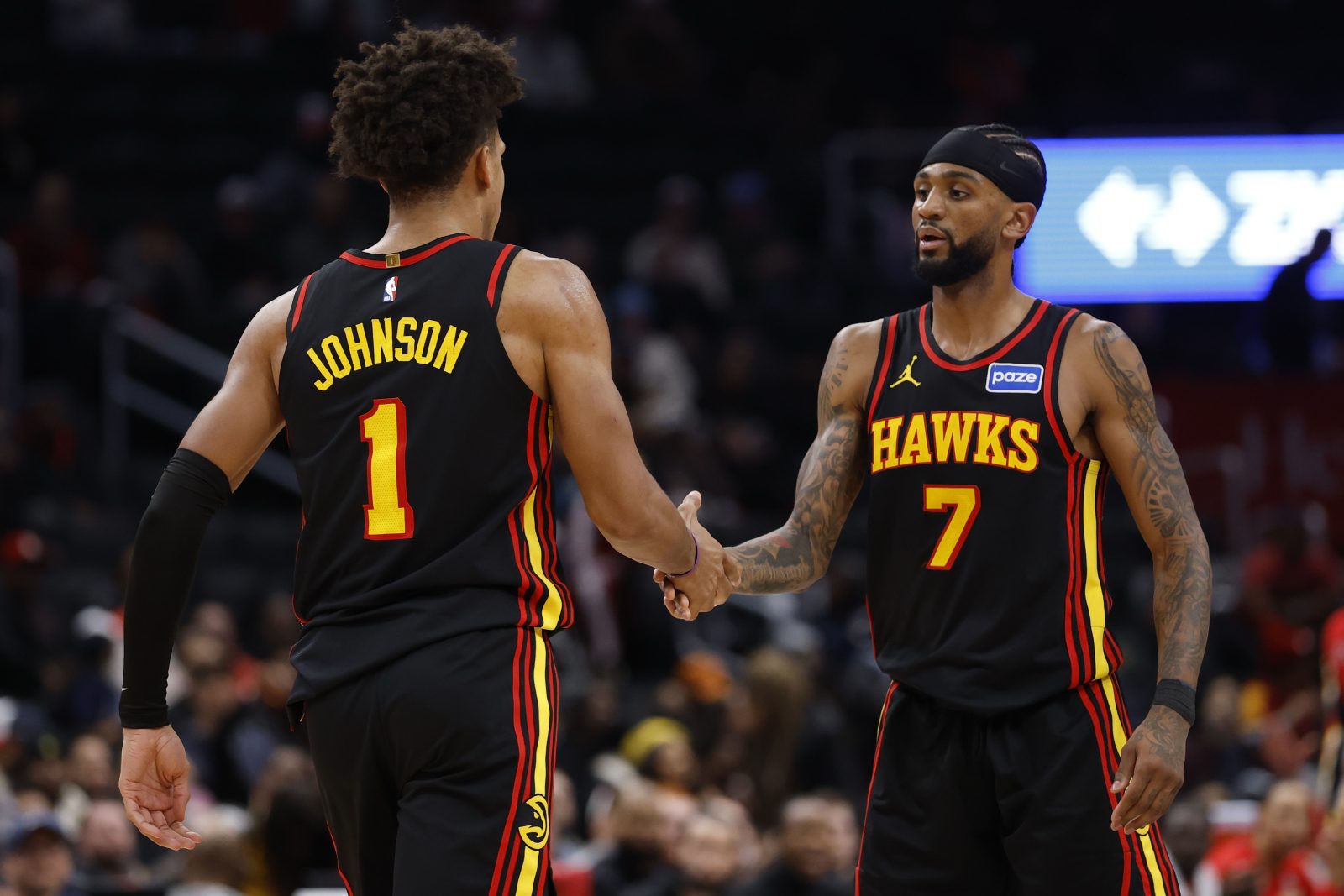 Dec 6, 2025; Washington, District of Columbia, USA; Atlanta Hawks forward Jalen Johnson (1) celebrates with Hawks guard Nickeil Alexander-Walker (7) after scoring while being fouled against the Washington Wizards in the second half at Capital One Arena. Mandatory Credit: Geoff Burke-Imagn Images
