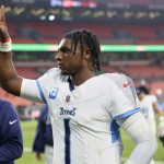 Dec 7, 2025; Cleveland, Ohio, USA; Tennessee Titans quarterback Cam Ward (1) acknowledges the crowd after the game against the Cleveland Browns at Huntington Bank Field. Mandatory Credit: Scott Galvin-Imagn Images