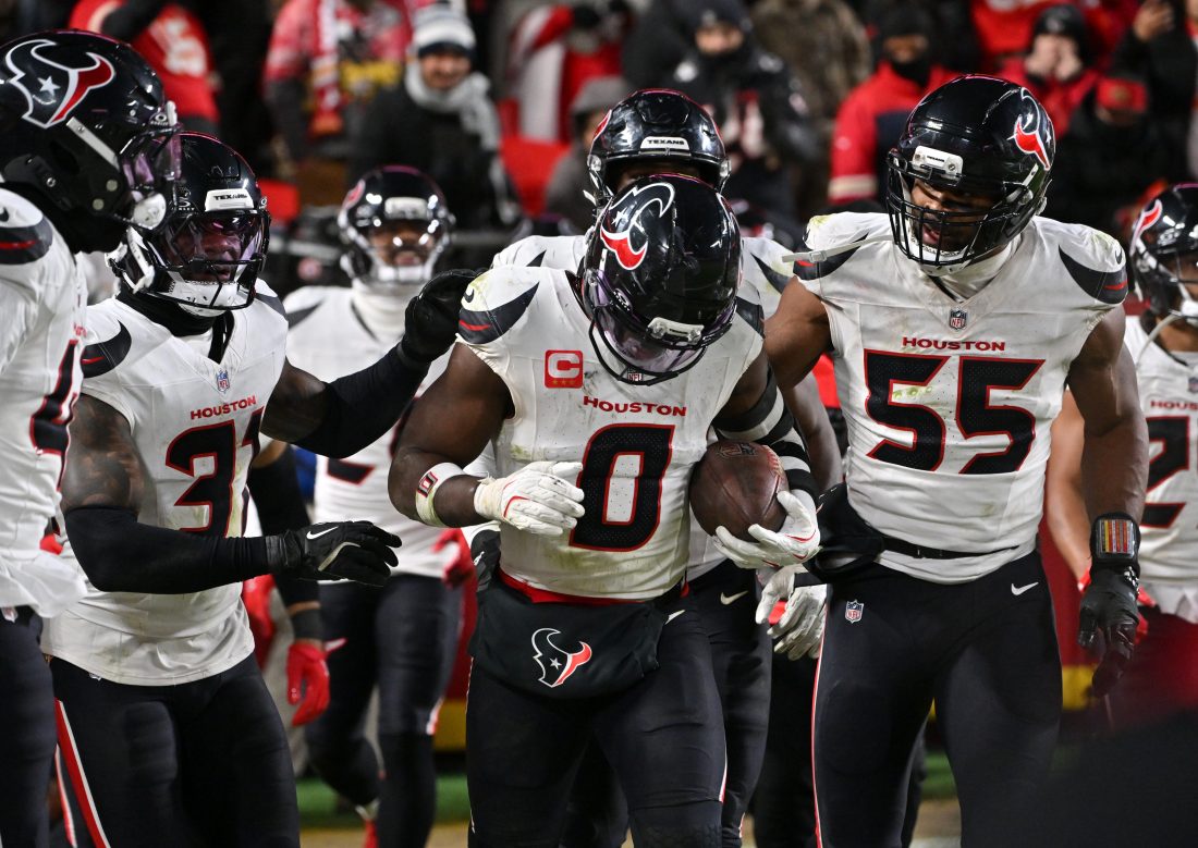 Dec 7, 2025; Kansas City, Missouri, USA; Houston Texans linebacker Azeez Al-Shaair (0) celebrates with his teammates after an interception during the fourth quarter against the Kansas City Chiefs at GEHA Field at Arrowhead Stadium. Mandatory Credit: Amy Kontras-Imagn Images