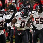 Dec 7, 2025; Kansas City, Missouri, USA; Houston Texans linebacker Azeez Al-Shaair (0) celebrates with his teammates after an interception during the fourth quarter against the Kansas City Chiefs at GEHA Field at Arrowhead Stadium. Mandatory Credit: Amy Kontras-Imagn Images