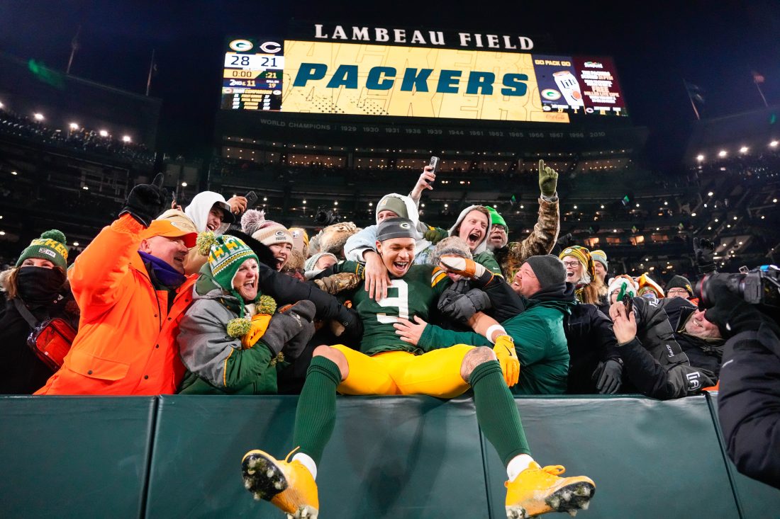 Dec 7, 2025; Green Bay, Wisconsin, USA; Green Bay Packers wide receiver Christian Watson (9) celebrates with fans after defeating the Chicago Bears at Lambeau Field. Mandatory Credit: Jeff Hanisch-Imagn Images
