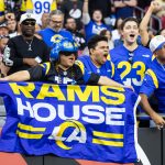 Dec 7, 2025; Glendale, Arizona, USA; Los Angeles Rams fans in the crowd celebrate a touchdown against the Arizona Cardinals during the second half at State Farm Stadium.