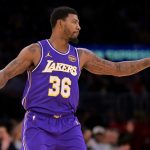 Dec 10, 2025; Los Angeles, California, USA; Los Angeles Lakers guard Marcus Smart (36) reacts after a 3-point basket during the second half against the San Antonio Spurs at Crypto.com Arena.