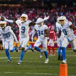 Dec 14, 2025; Kansas City, Missouri, USA; Los Angeles Chargers safety Derwin James Jr. (3) celebrates with cornerback Donte Jackson (26) and linebacker Daiyan Henley (0) following an interception against the Kansas City Chiefs during the fourth quarter at GEHA Field at Arrowhead Stadium. Mandatory Credit: Jay Biggerstaff-Imagn Images