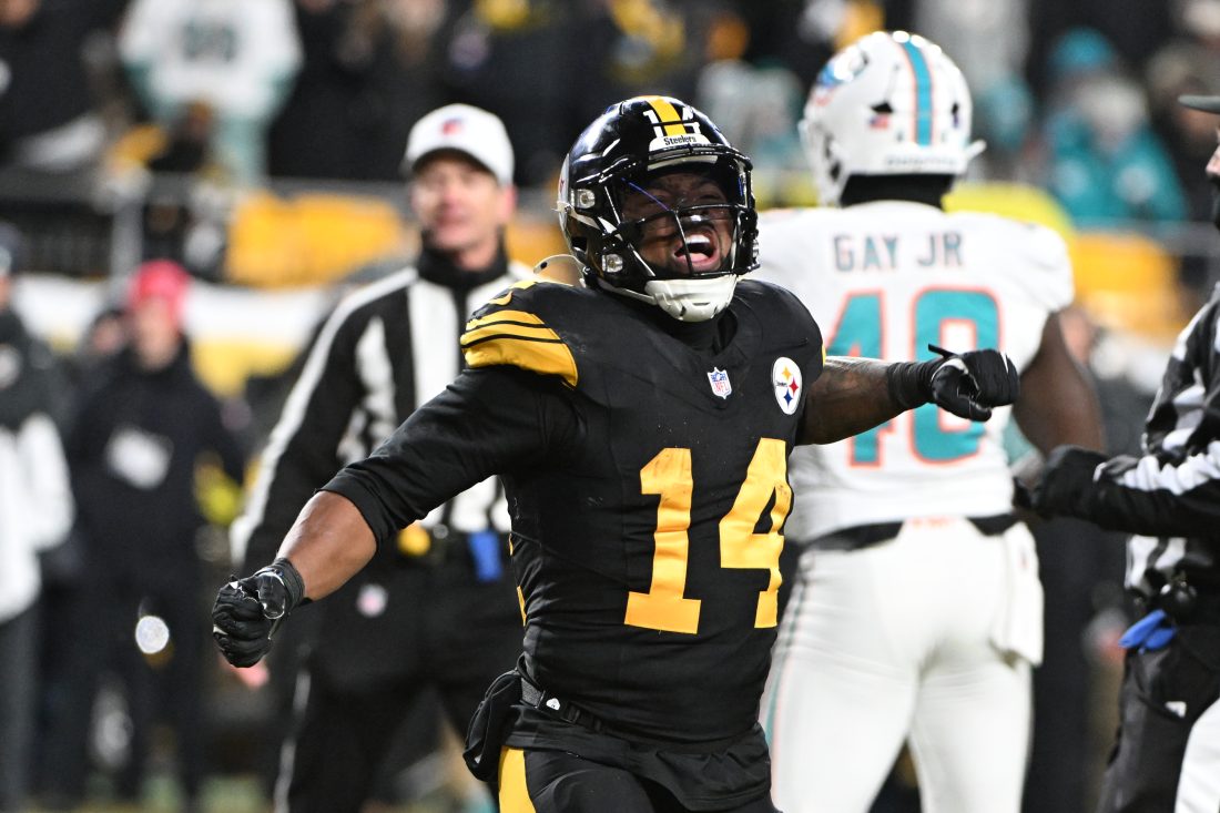 Dec 15, 2025; Pittsburgh, Pennsylvania, USA; Pittsburgh Steelers running back Kenneth Gainwell (14) celebrates a touchdown scored by tight end Connor Heyward (83) in the second quarter against the Miami Dolphins at Acrisure Stadium. Mandatory Credit: Barry Reeger-Imagn Images