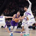 Dec 18, 2025; Salt Lake City, Utah, USA; Los Angeles Lakers forward/guard Luka Doncic (77) is fouled by Utah Jazz guard/forward Svi Mykhailiuk (10) during the first quarter at Delta Center.