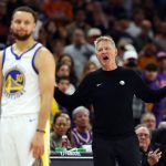 Dec 18, 2025; Phoenix, Arizona, USA; Golden State Warriors guard Stephen Curry (30) reacts alongside head coach Steve Kerr against the Phoenix Suns in the second half at Mortgage Matchup Center.