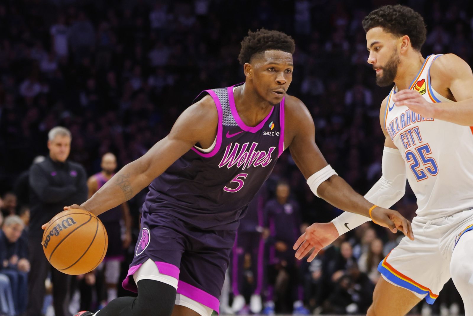 Dec 19, 2025; Minneapolis, Minnesota, USA; Minnesota Timberwolves guard Anthony Edwards (5) works around Oklahoma City Thunder guard Ajay Mitchell (25) in the fourth quarter at Target Center. Mandatory Credit: Bruce Kluckhohn-Imagn Images