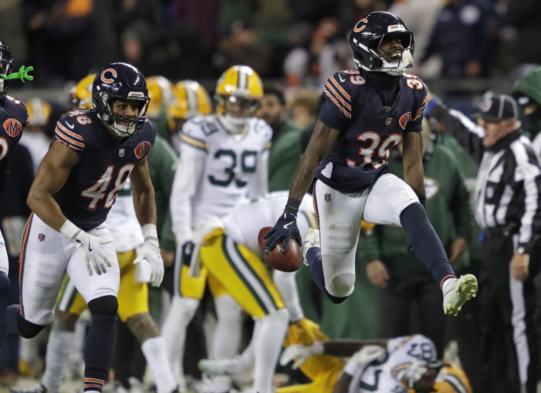 Dec 20, 2025; Chicago, Illinois, USA; Chicago Bears cornerback Josh Blackwell (39) celebrates recovering an onside kick mishandled by Green Bay Packers wide receiver Romeo Doubs (87) in the fourth quarter at Soldier Field.
