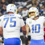 Dec 21, 2025; Arlington, Texas, USA; Los Angeles Chargers quarterback Justin Herbert (10) celebrates with center Bradley Bozeman (75) after rushing for a touchdown against the Dallas Cowboys during the second quarter at AT&T Stadium. Mandatory Credit: Kevin Jairaj-Imagn Images