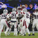 Dec 21, 2025; Baltimore, Maryland, USA; New England Patriots cornerback Marcus Jones (25) celebraets a fumble recovery with teammates during the second half of the game against the Baltimore Ravens at M&T Bank Stadium. Mandatory Credit: James Lang-Imagn Images