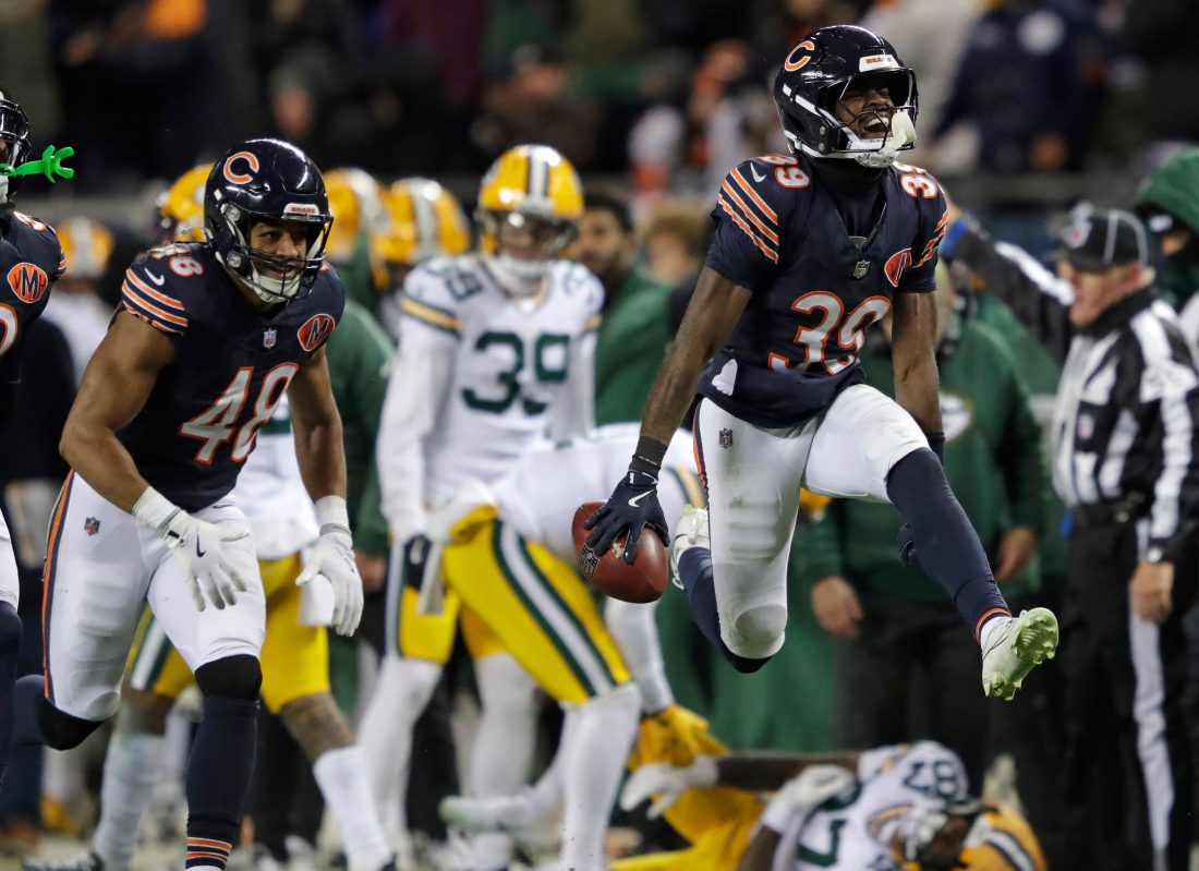 Chicago Bears cornerback Josh Blackwell (39) celebrates recovering an onside kick mishandled by Green Bay Packers wide receiver Romeo Doubs (87) in the fourth quarter during their football game Saturday, December 20, 2025, at Soldier Field in Chicago, Illinois.