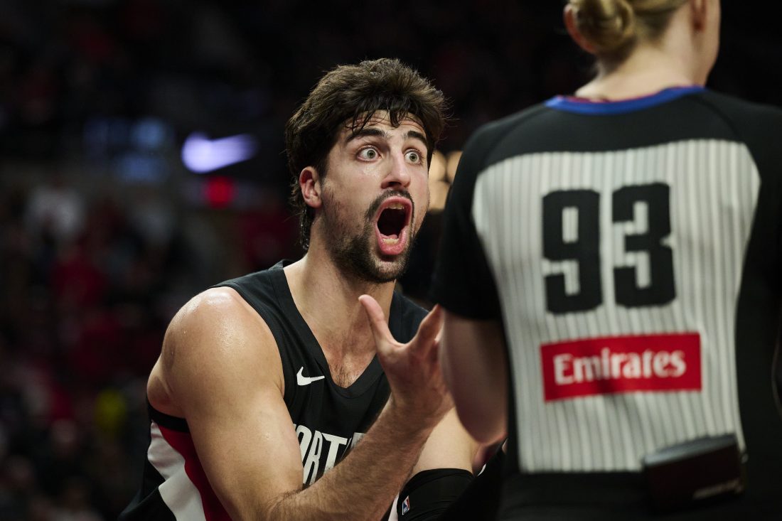 Dec 22, 2025; Portland, Oregon, USA; Portland Trail Blazers forward Deni Avdija (8) reacts toward a referee after getting called for a foul during the second half against the Detroit Pistons at Moda Center. Mandatory Credit: Troy Wayrynen-Imagn Images