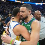 Dec 25, 2025; San Francisco, California, USA; Golden State Warriors guard Stephen Curry (center left) and Dallas Mavericks guard Klay Thompson (center right) greet each other after the game at Chase Center. Mandatory Credit: Darren Yamashita-Imagn Images