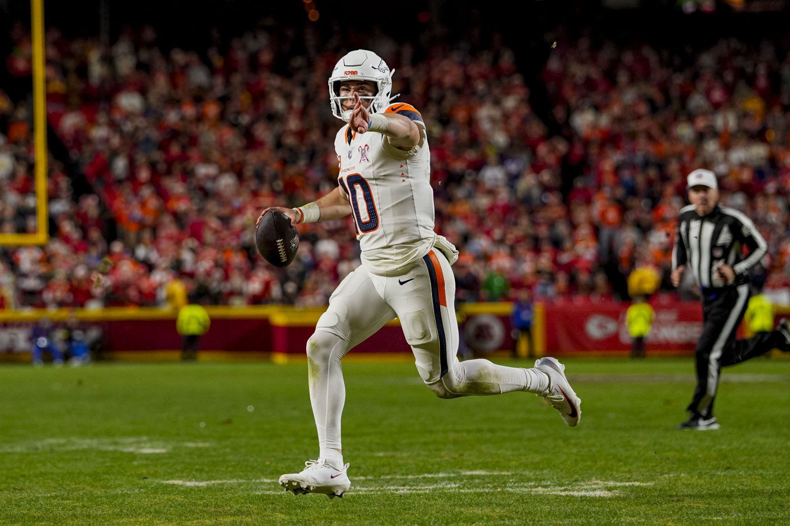 Dec 25, 2025; Kansas City, Missouri, USA; Denver Broncos quarterback Bo Nix (10) throws a toucdown pass during the fourth quarter at GEHA Field at Arrowhead Stadium.
