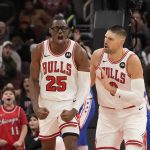 Dec 26, 2025; Chicago, Illinois, USA; Chicago Bulls forward Jalen Smith (25) gestures after dunking the ball against the Philadelphia 76ers as center Nikola Vucevic (9) stands nearby during the second half at United Center. Mandatory Credit: David Banks-Imagn Images