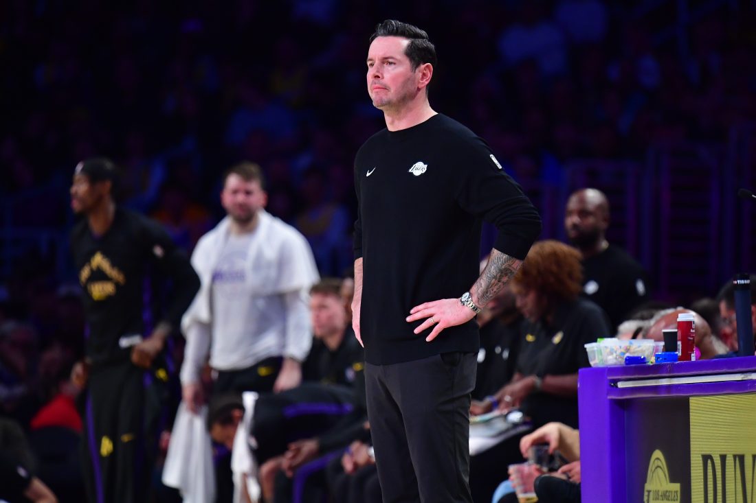 Dec 30, 2025; Los Angeles, California, USA; Los Angeles Lakers head coach JJ Redick watches game action against the Detroit Pistons during the first half at Crypto.com Arena. Mandatory Credit: Gary A. Vasquez-Imagn Images