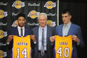 July 5, 2016; El Segundo, CA, USA; Los Angeles Lakers draft picks Ivica Zubac and Brandon Ingram pose with jerseys with general manager Mitch Kupchak before being introduced to media at Toyota Sports Center. Mandatory Credit: Gary A. Vasquez-USA TODAY Sports