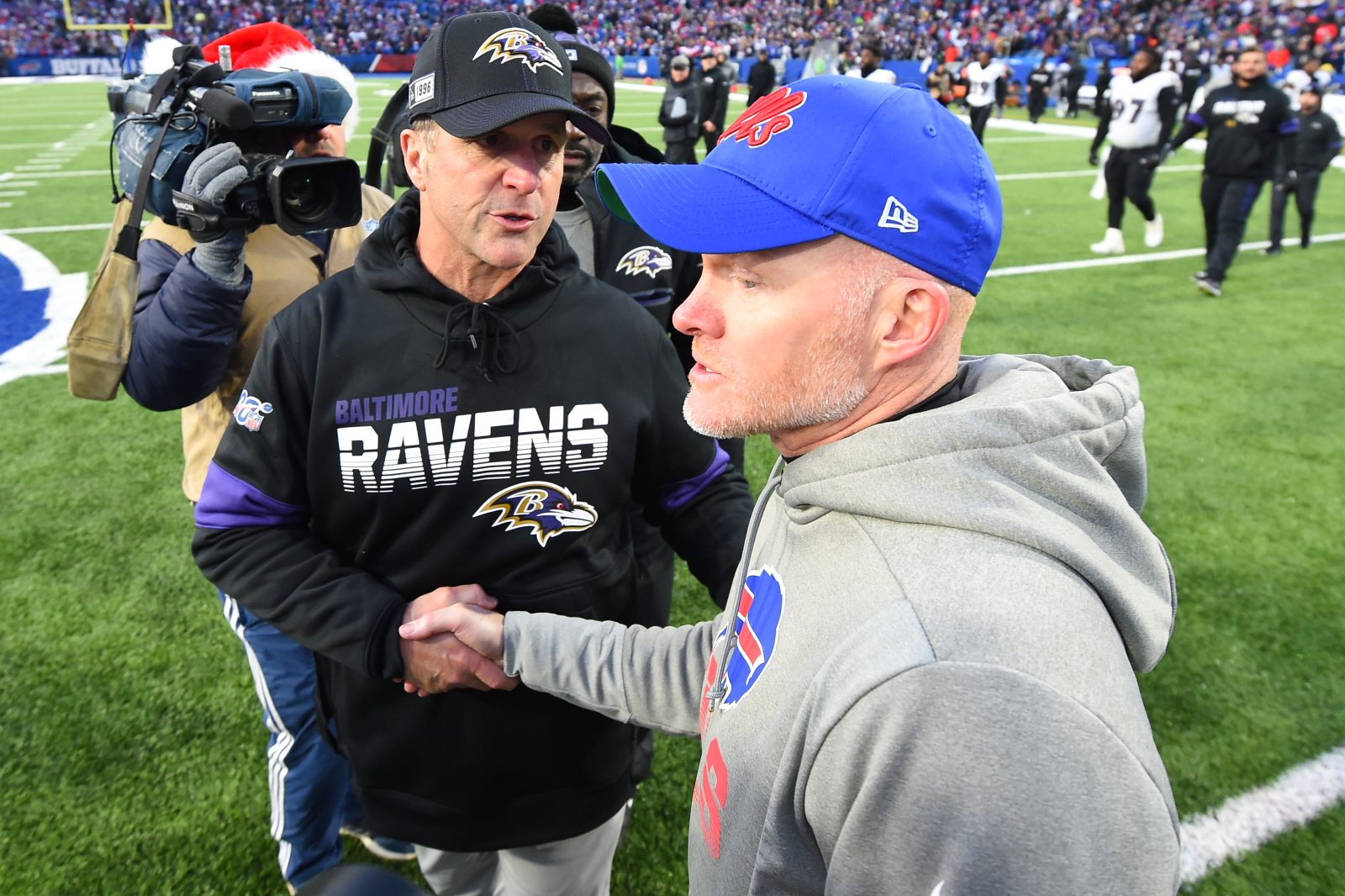 Dec 8, 2019; Orchard Park, NY, USA; Baltimore Ravens head coach John Harbaugh and Buffalo Bills head coach Sean McDermott shake hands following the game at New Era Field. Mandatory Credit: Rich Barnes-USA TODAY Sports