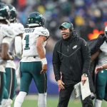 Dec 11, 2022; East Rutherford, New Jersey, USA; Philadelphia Eagles assistant coach Kevin Patullo celebrates with quarterback Jalen Hurts (1) after a touchdown during the second half against the New York Giants at MetLife Stadium.