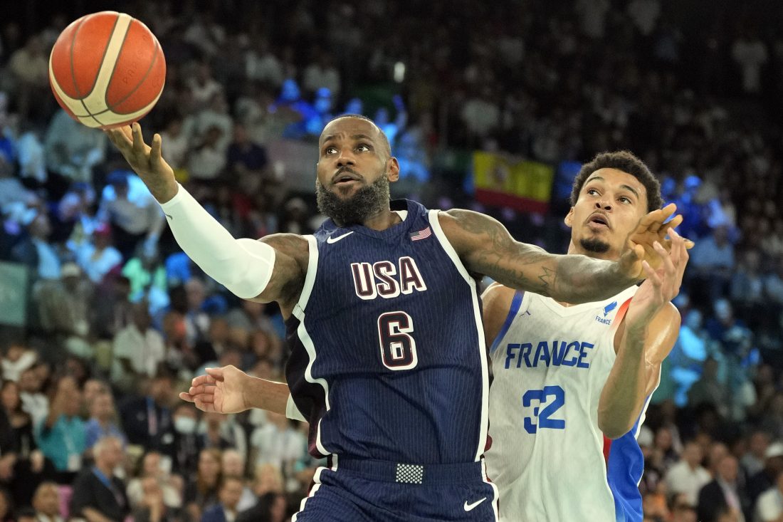 Aug 10, 2024; Paris, France; United States guard LeBron James (6) shoots against France power forward Victor Wembanyama (32) in the first half in the men's basketball gold medal game during the Paris 2024 Olympic Summer Games at Accor Arena. Mandatory Credit: Kyle Terada-USA TODAY Sports