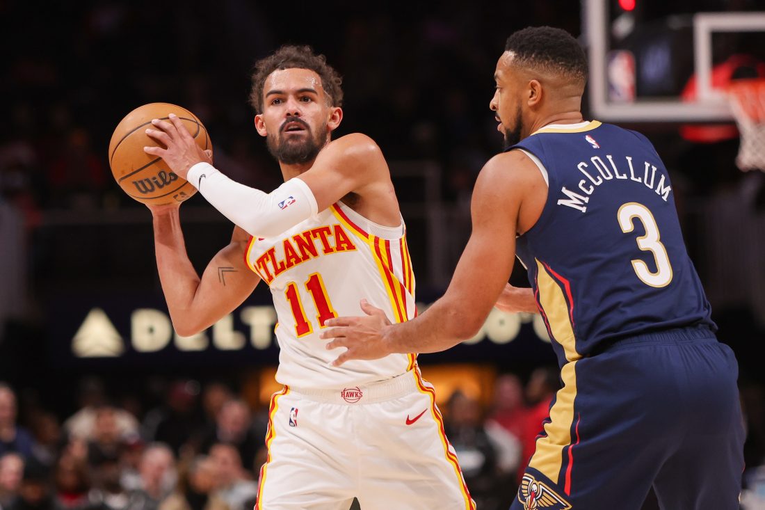 Dec 2, 2024; Atlanta, Georgia, USA; Atlanta Hawks guard Trae Young (11) is defended by New Orleans Pelicans guard CJ McCollum (3) in the second quarter at State Farm Arena. Mandatory Credit: Brett Davis-Imagn Images
