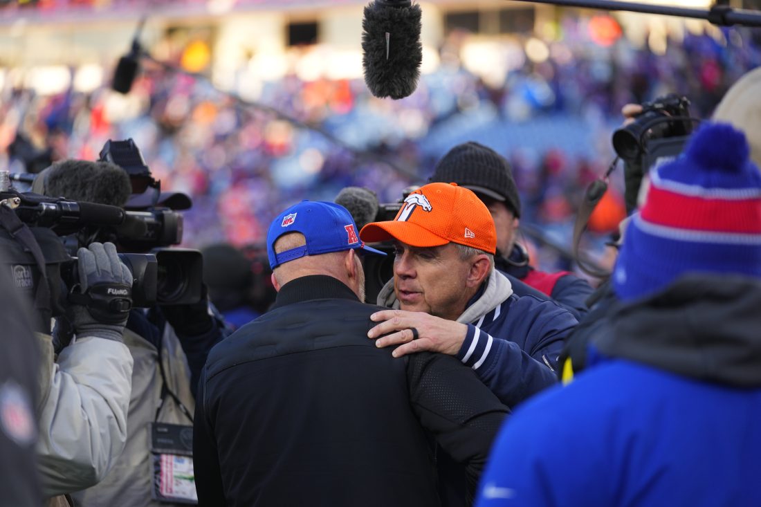 Jan 12, 2025; Orchard Park, New York, USA; Buffalo Bills head coach Sean McDermott and Denver Broncos head coach Sean Payton shake hands following the AFC wild card game at Highmark Stadium. Mandatory Credit: Gregory Fisher-Imagn Images
