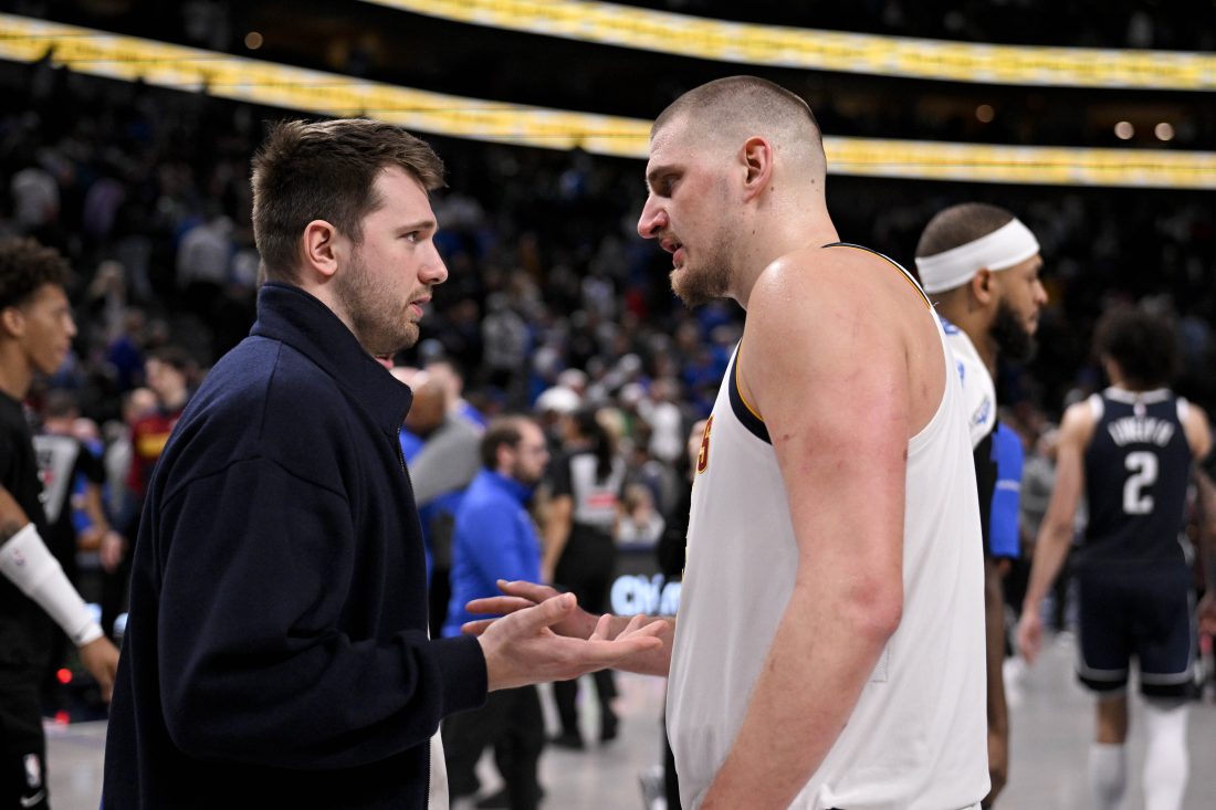 Jan 12, 2025; Dallas, Texas, USA; Dallas Mavericks guard Luka Doncic (left) talks with Denver Nuggets center Nikola Jokic (right) after the game at the American Airlines Center. Mandatory Credit: Jerome Miron-Imagn Images