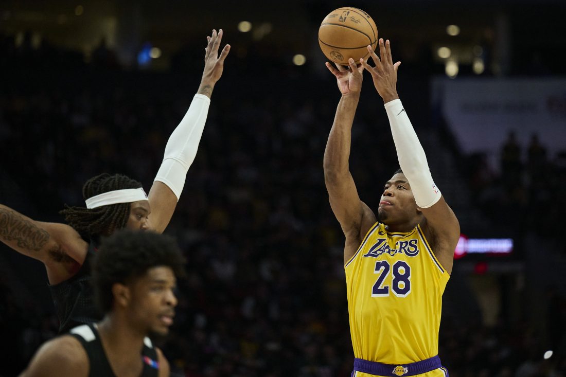 Feb 20, 2025; Portland, Oregon, USA; Los Angeles Lakers forward Rui Hachimura (28) shoots a jump shot during the second half against Portland Trail Blazers center Robert Williams III (35) at Moda Center. Mandatory Credit: Troy Wayrynen-Imagn Images